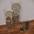 Decorative Ornament Set with Clear Glass Containers Dried Flowers Pebbles and Black Candles on Wooden Tabletop