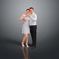 Woman in white dress making heart shape with man against gray background and floor reflection