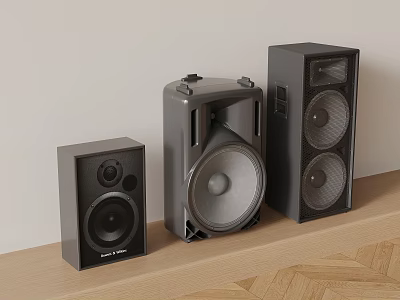 Three Black Modern Audio Speakers in Different Sizes on Wooden Table 3d model
