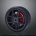 Sporty Car Wheel Design With Red Brake Caliper And Performance Tire