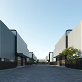 Modern Industrial Factory Building With White Exterior Large Windows Green Grass Waterfront And Blue Sky