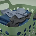 Green Perforated Laundry Basket Holding Colorful Clothes For Everyday Use