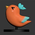 Cute Orange Bird Figurine With Yellow Beak Black Eyes Blue Wings On Black Base