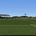 Soccer Field With Players In Action During Match With Spectators In Stands