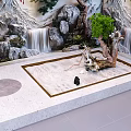 Zen Garden Feature Design With Raked Sand Driftwood Potted Tree And Waterfall Backdrop