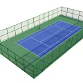 Outdoor Tennis Court With Green Surface And Blue Playing Area Surrounded By Green Fence