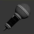 Handheld Microphone With Metal Mesh Grille And Silver Black Textured Surface For Daily Use