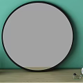 Round Black Framed Mirror on Green Wall with Wooden Shelf and Decorative Bottles