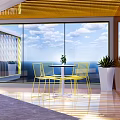 Modern Relaxation Area With Large Glass Windows Sea View Yellow Chairs And White Table