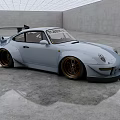 Light Blue Sports Car With Rear Spoiler And Golden Wheels In Empty Indoor Space