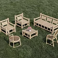 Outdoor Table and Chair Set with Wicker Chairs Wooden Bench and Flower Vase on Grass