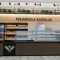 Sweet Shop Interior With Glass Display Counter Fresh Breads Wooden Decor And Green Plants