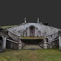 Elegant Sculpture Carving On Ancient Stone Structure With Stairs And Grassy Courtyard