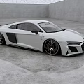 White Audi Two Door Sports Car In Spacious Modern Studio With Reflective Floor