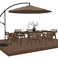 Outdoor Table with Chairs and Patio Umbrella on Wooden Deck with Decorative Branch