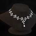 Elegant Silver Necklace With Delicate Flower And Leaf Design And Pendant Drop