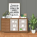 Wooden Sideboard with Drawers Glass Door Cabinets and Decorative Sign Plants Clock on Gray Wall