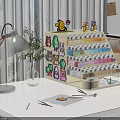 Building blocks storage shelf with cartoon stickers and Pokemon figures holding paint bottles on desktop