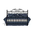 Ornate Black Iron Double Bed with Navy Blue Bedding and Striped Sheets