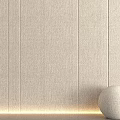Light Colored Wall Panels With Textured Vertical Lines Bottom Light Strip And Round Beige Decor