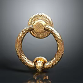 Golden Ornate Ring Shaped Door Handle With Intricate Carved Patterns And Detailed Design