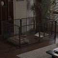 Black Metal Pet Cage with Soft Mat and Toys in Living Room with Wooden Floor