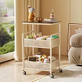 White Multi Tiered Rolling Mesh Shelf with Decorations Books and Storage Boxes in Living Room