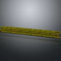 Natural Long Yellow Bamboo Stalks Bundled Together On Dark Surface