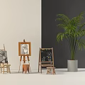 Sketching Art Supplies Display With Easels Drawing Boards Stools And Potted Palm Tree In White Gray Room