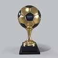 Golden Football Shaped Trophy With Shiny Surface And Black Base Design