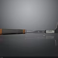 Scraper Tool Featuring Gray And Orange Handle Silver Metal Blade And Barcode Label