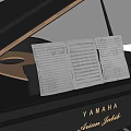 YAMAHA Piano With Sheet Music Placed On Top For Musical Practice And Learning