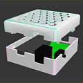 White Compact Computer Hardware Module with Top Ventilation Holes and Internal Green Black Parts