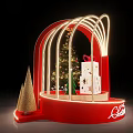 Christmas Display With Red Arched Frame Lights Decorated Tree And Merry Sign