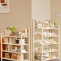 Multi tiered Light Colored Shoe Rack with Shoes Handbags Green Plants Books and Decorative Items
