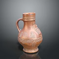 Antique Terracotta Vase With Intricate Carved Patterns And Decorative Handle Displayed On Dark Background
