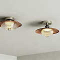 Two Modern Ceiling Lights With Wooden Frame And Transparent Lampshade On White Ceiling