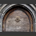 Antique Stone Archway Entry Door With Wooden Panel And Brass Door Knocker
