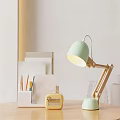 Light Green Minimalist Table Lamp with Wooden Base on Desk for Study and Stationery