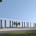 Modern Industrial Warehouse Exterior With Large Windows Trees Parking Lot And Grass Area