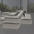 Modern Beige L-shaped Sofa Coffee Table Set with Round Table Wooden Accents and Green Plant