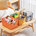 Colorful Storage Bins with Stuffed Toys Snacks and Books on Wooden Table in Living Room