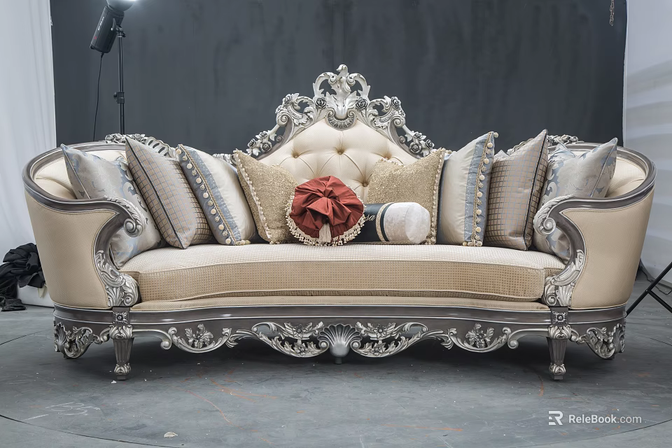Ornate Three Seater Sofa With Silver Carved Frame Beige Upholstery Red Bow And Decorative Pillows 3d model 