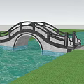 Scenic Landscape Bridge Over Calm Water With Lush Green Trees And Grass