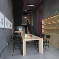 Spacious Art Studio Interior With Wooden Table Chairs And Artworks On Gray Walls
