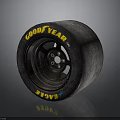 Goodyear Eagle Car Tire With Worn Appearance And Black Wheel Rim