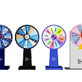 Various Colored Wheel Sculptures With Segmented Sections And Sturdy Bases For Games