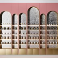 Elegant Arched Display Shelves with Golden Frames on Pink Walls Holding Bottles and Jars