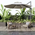 Cozy Outdoor Patio Table And Chairs Set With Umbrella And Lush Green Plants