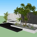 Modern Black Panel Garden Feature Wall With Lush Tree Green Plants And Water Basin